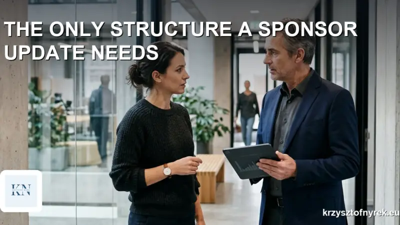 Project manager briefing a sponsor in an office hallway