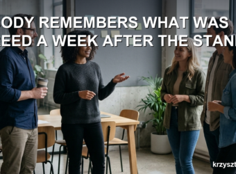 A project team at a morning standup in an office, one person speaking while others listen